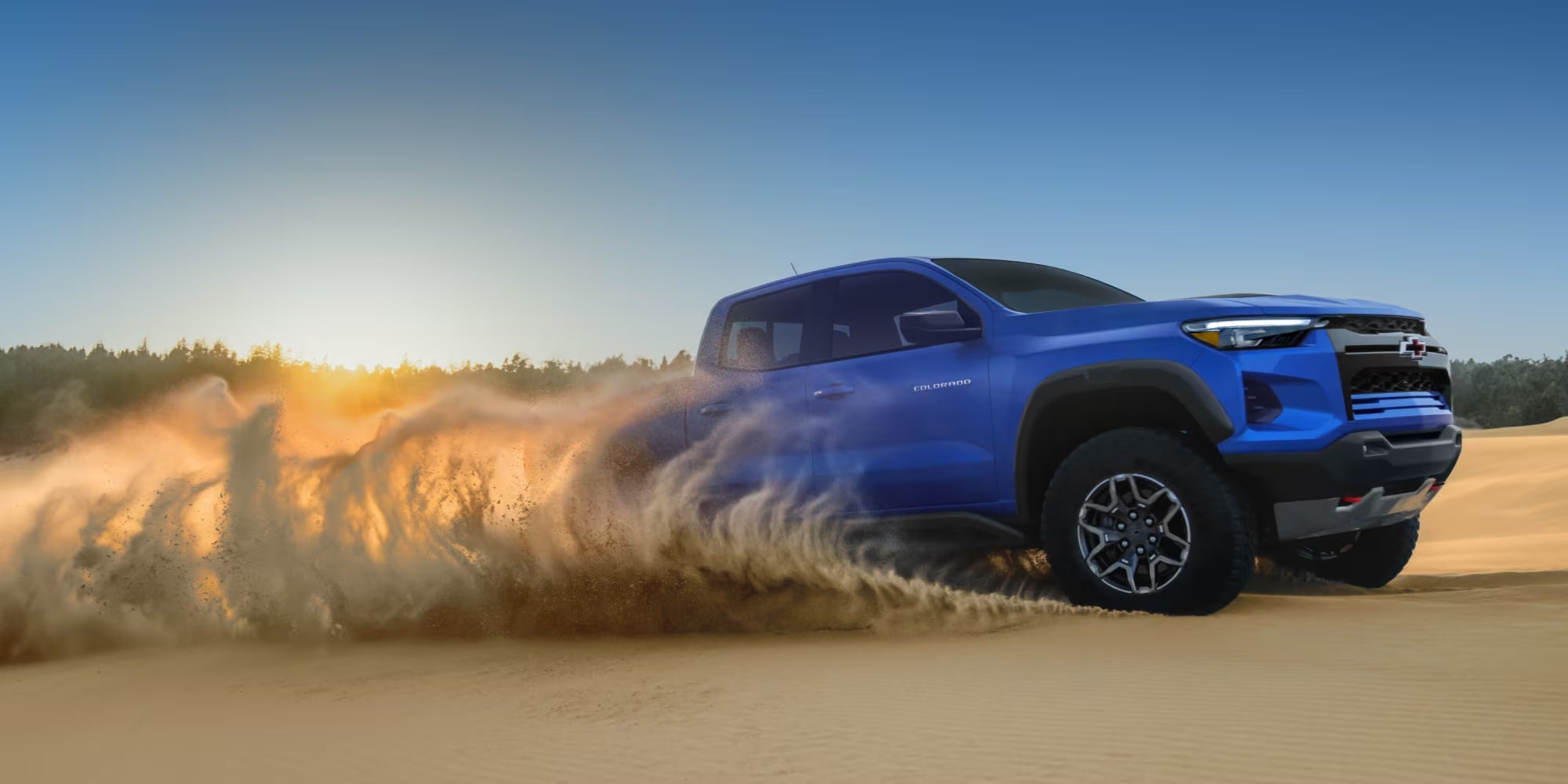 Blue 2026 Chevy Colorado off-roading - Near Devola