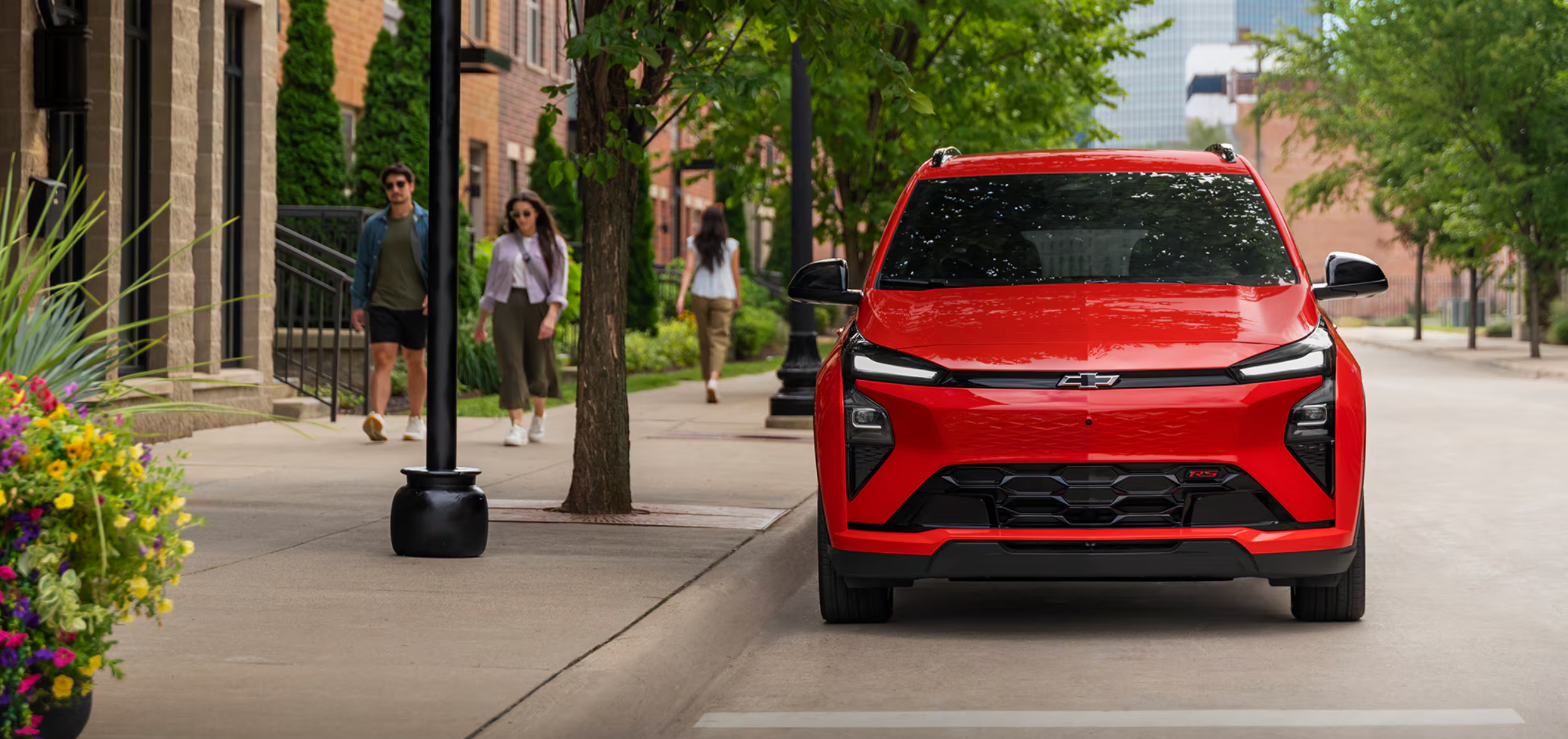 Front end of red 2027 Chevy Bolt near Devola